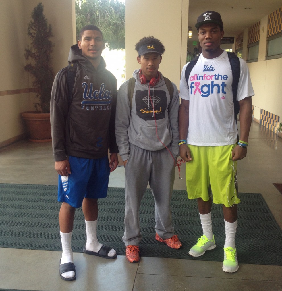 UCLA student-athletes (right and left) and UCLA student (center)