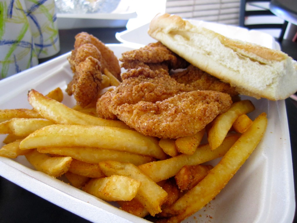 Cajun style fish, french fries, and French bread