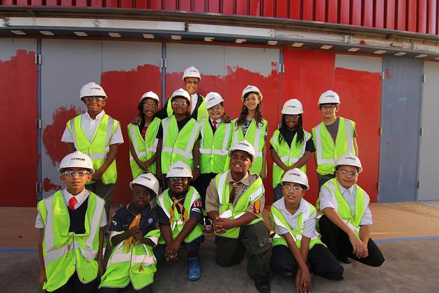 Local youth help paint The Forum red./ Source: Inglewood Today News