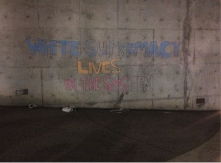 Chalk message left unfinished after police detained the students.